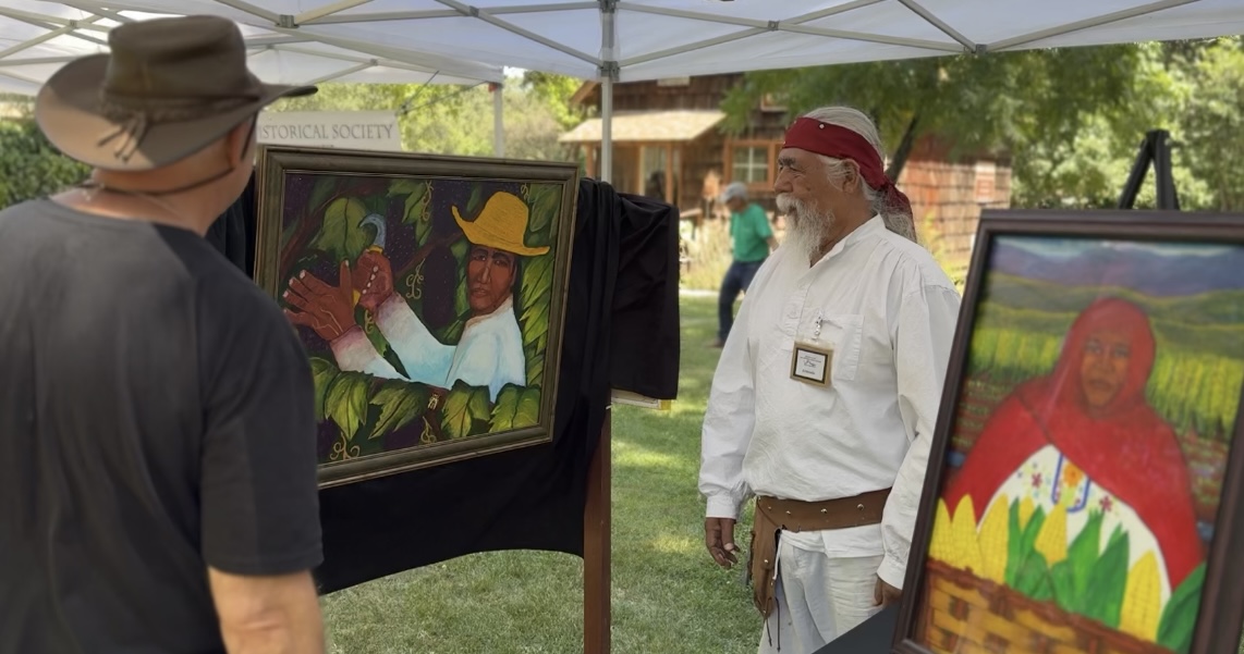 Peña Adobe Historical Society Docent Armando Perez shares his paintings with park visitors.